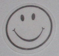 Smiley op een soort snoeppapier